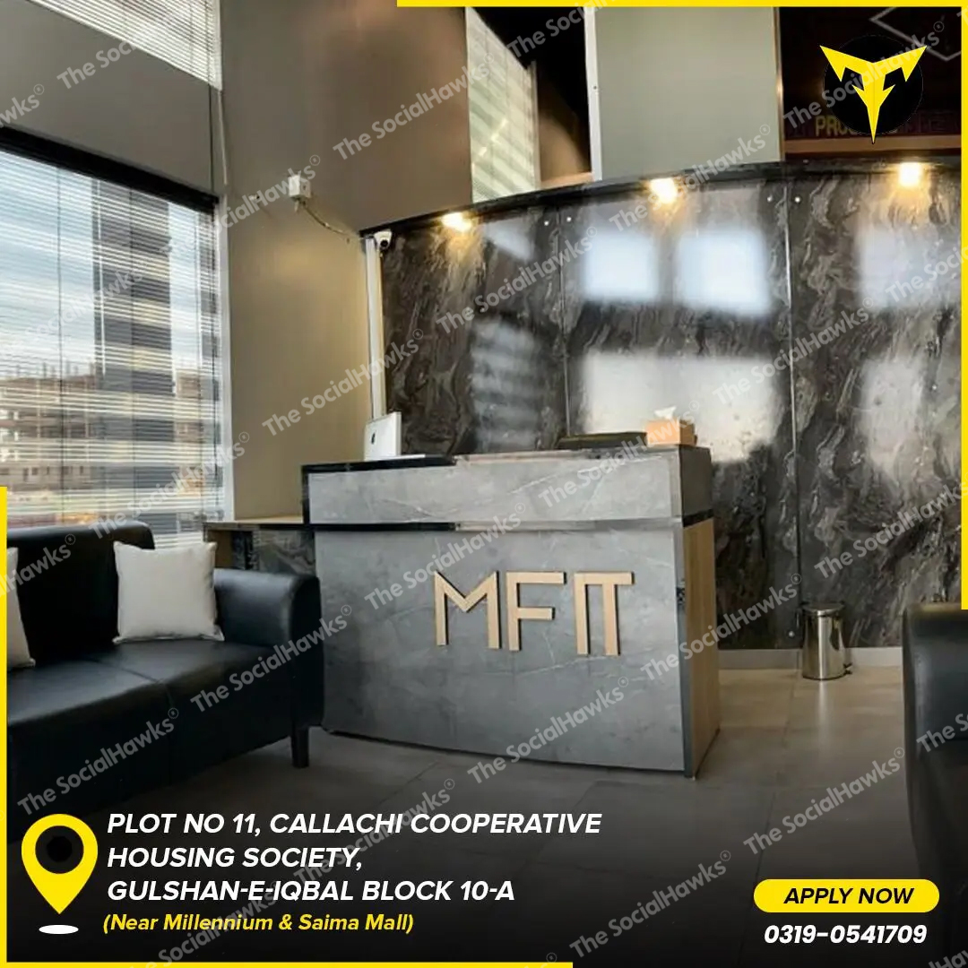 MFit gym reception desk with marble counter and gold logo signage showing location address